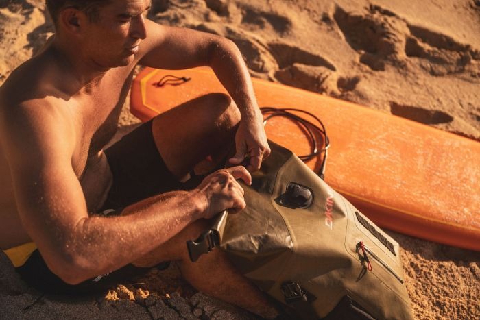 Dakine’s Cyclone Wet/Dry Rolltop Pack at beach