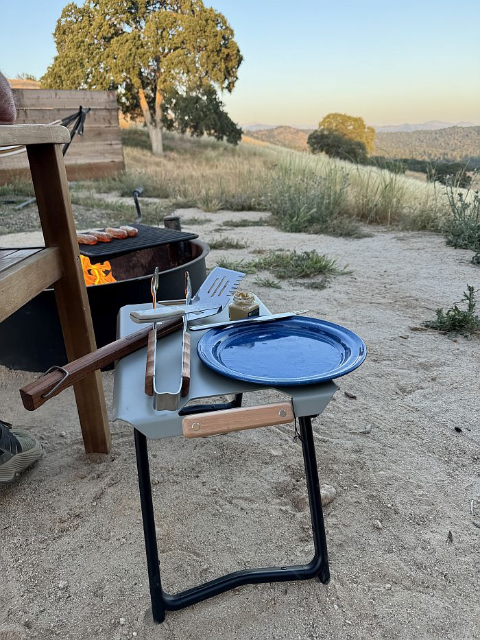 REI Co-op Outward Side Table next to camp fire