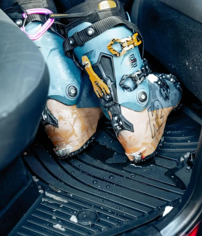 ski boots in a car with 3W car mats on floor