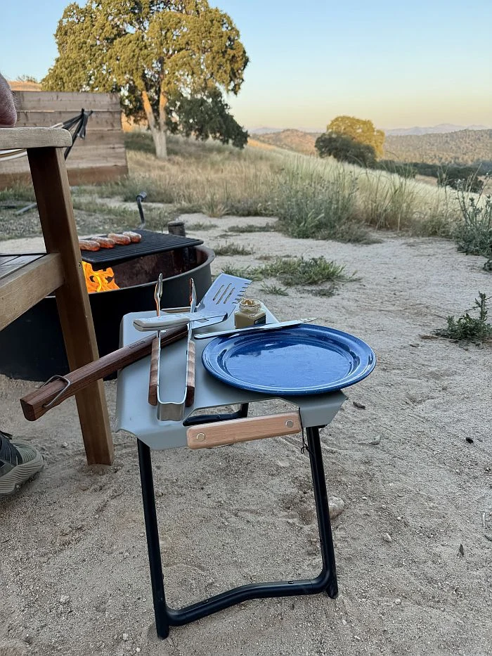 REI Co-op Outward Side Table next to camp fire