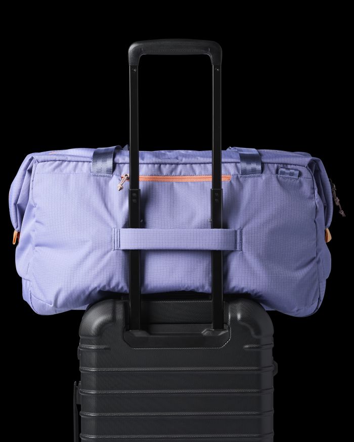 Cotopaxi Viaje 45L Travel Duffel on top of a suitcase