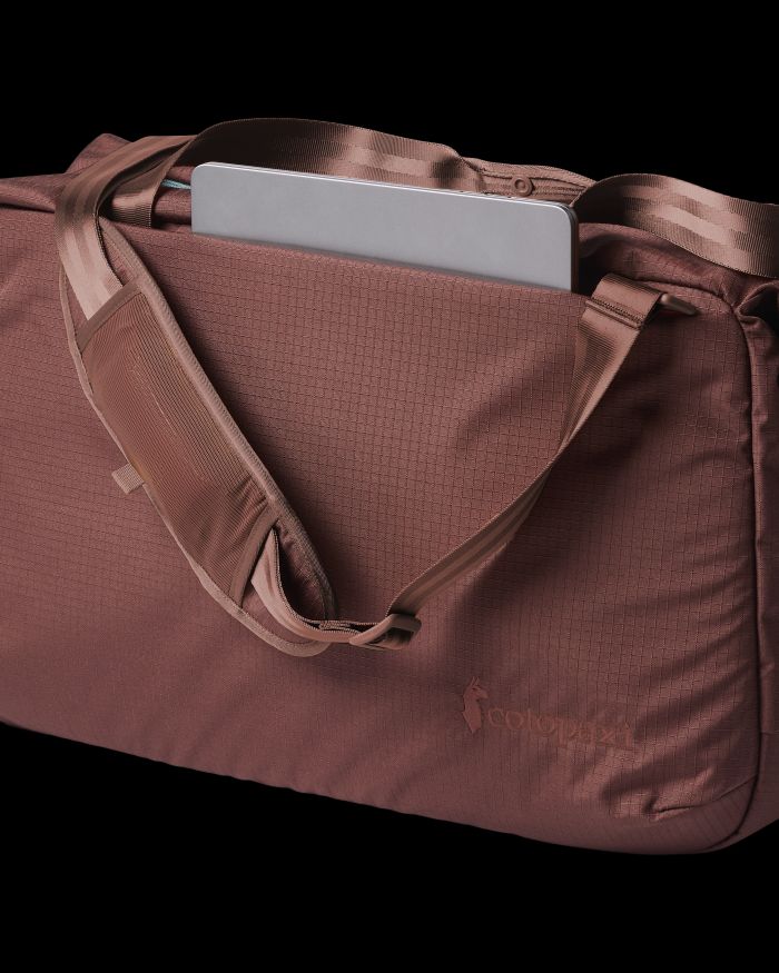Laptop in the pocket of a Cotopaxi Viaje 45L Travel Duffel