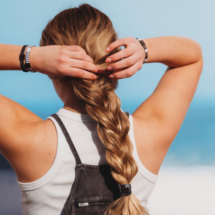 K'lani hair and writst bands on a woman's wrists and in her hair